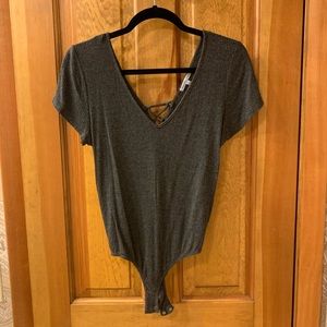 grey strappy-back bodysuit